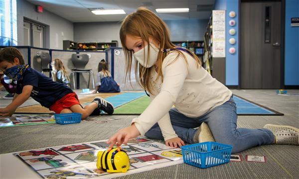 Girl uses BeeBot